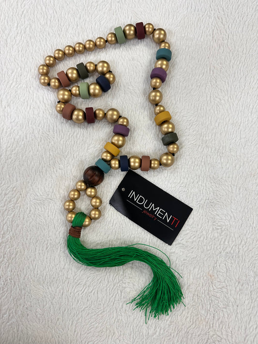 Plus gold with green tassel